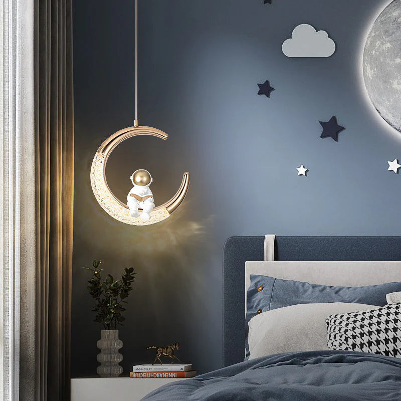 Astronaut Sitting on Illuminated Crescent Moon Pendant Light – Gold & White