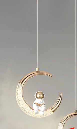 Astronaut Sitting on Illuminated Crescent Moon Pendant Light – Gold & White