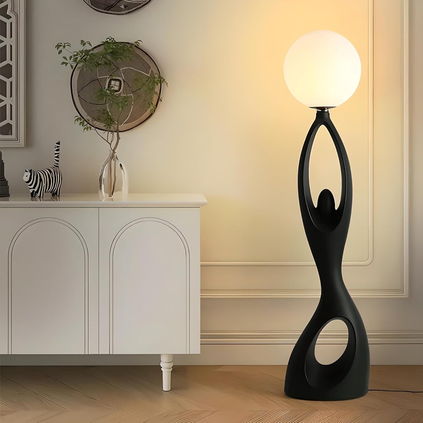 Designer Black sculpture holding ball Floor Lamp
