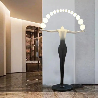 Designer Black White sculpture holding ball floor lamp